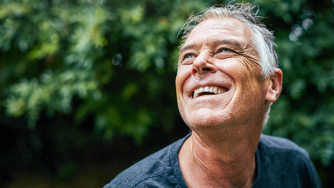 man-smiling-eyes-wellbeing-16-9-1120x630px